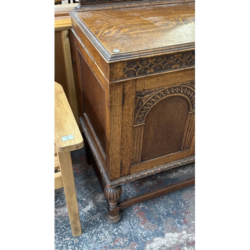 38 - An early 20th century carved oak sideboard on baluster supports - approx. 102cm high x 137cm wide x ... 