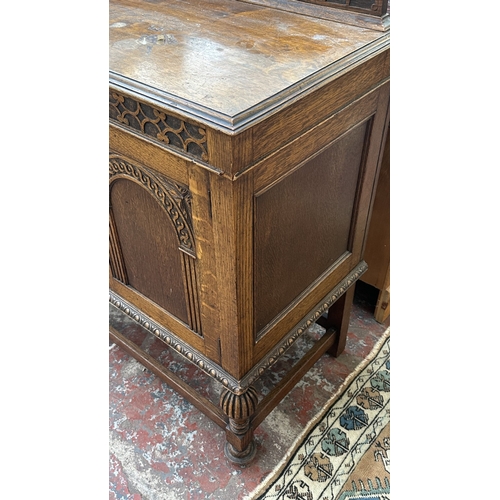 38 - An early 20th century carved oak sideboard on baluster supports - approx. 102cm high x 137cm wide x ... 