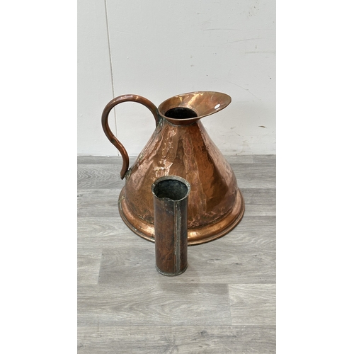 39 - A 19th century copper measuring jug - approx. 41cm high
