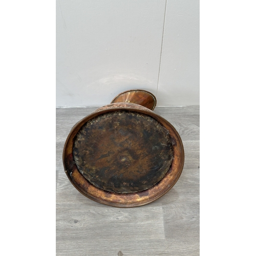 39 - A 19th century copper measuring jug - approx. 41cm high