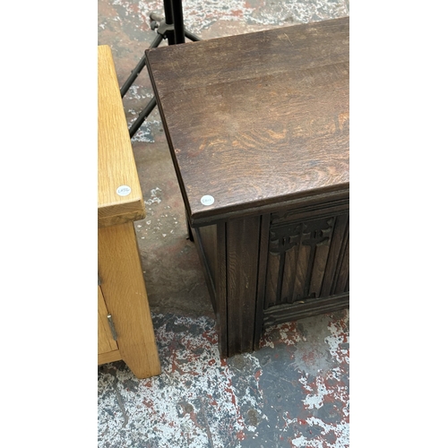 4 - A 17th century style carved oak linenfold blanket box - approx. 52cm high x 99cm wide x 40cm deep