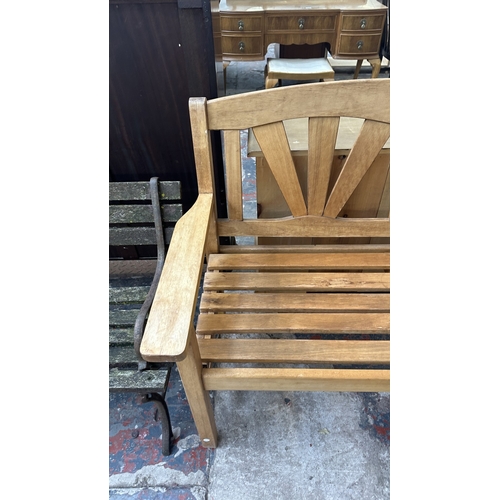 40 - A teak garden bench - approx. 92cm high x 131cm wide x 60cm deep