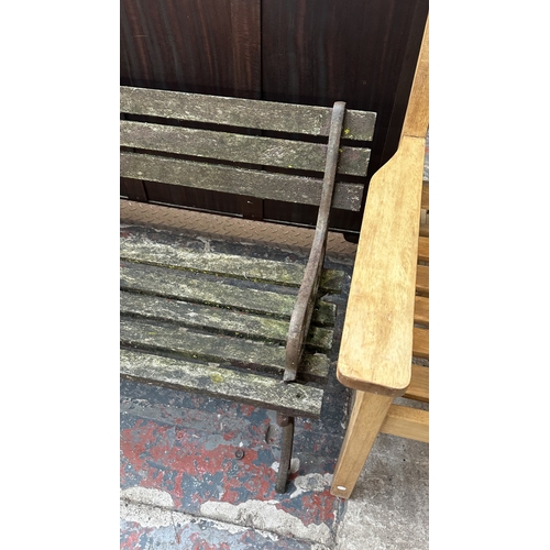 41 - A Victorian style cast metal and wooden slatted garden bench - approx. 68cm high x 122cm wide x 49cm... 