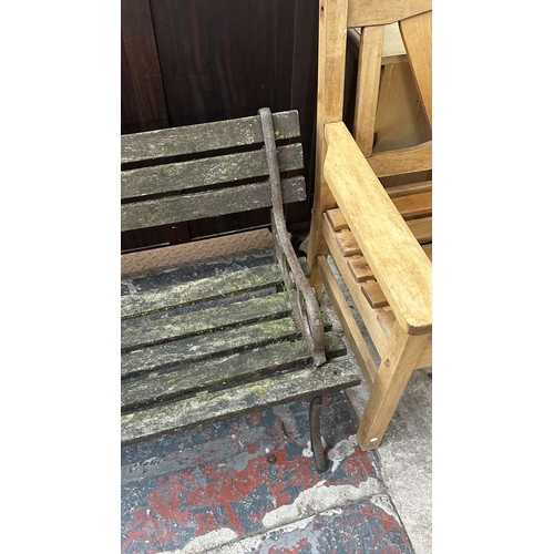 41 - A Victorian style cast metal and wooden slatted garden bench - approx. 68cm high x 122cm wide x 49cm... 