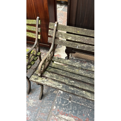 41 - A Victorian style cast metal and wooden slatted garden bench - approx. 68cm high x 122cm wide x 49cm... 