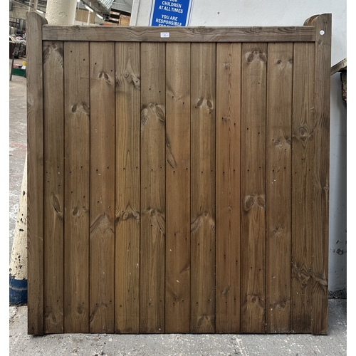 43 - A pair of tanalised timber driveway gates - approx. 144cm high x 134cm wide