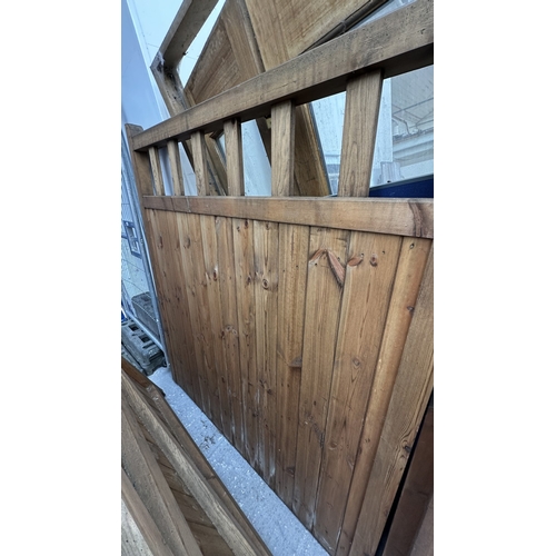 44 - A pair of tanalised timber driveway gates - approx. 182cm high x 160cm wide