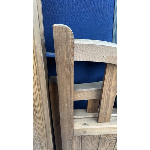 45 - A pair of tanalised timber arched top driveway gates - approx. 124cm high x 113cm wide