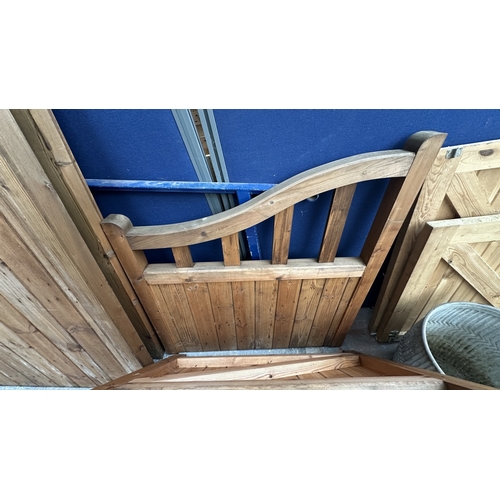 45 - A pair of tanalised timber arched top driveway gates - approx. 124cm high x 113cm wide