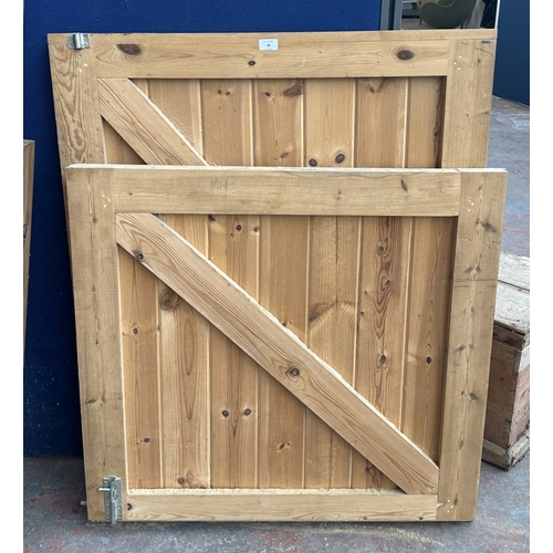 46 - A timber stable door with metal hinges and latch - approx. 200cm high x 91cm wide