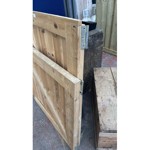 46 - A timber stable door with metal hinges and latch - approx. 200cm high x 91cm wide