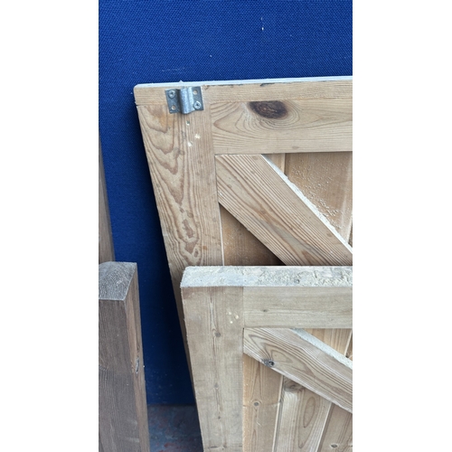46 - A timber stable door with metal hinges and latch - approx. 200cm high x 91cm wide