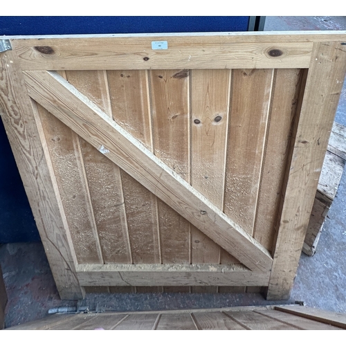 46 - A timber stable door with metal hinges and latch - approx. 200cm high x 91cm wide