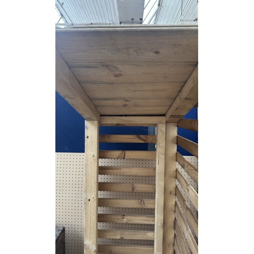 53 - A wooden log store - approx. 162cm high x 48cm wide x 66cm deep