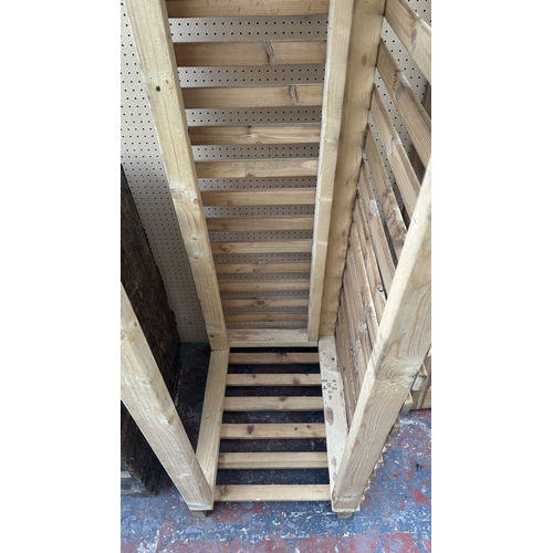 53 - A wooden log store - approx. 162cm high x 48cm wide x 66cm deep