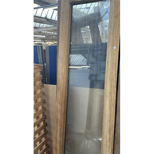 54 - A pair of wooden glazed conservatory doors with frame - approx. 236cm high x 122cm wide including fr... 