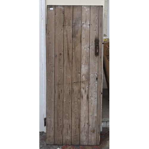 57 - A vintage wooden exterior door with metal hinges and latch - approx. 192cm high x 74cm wide
