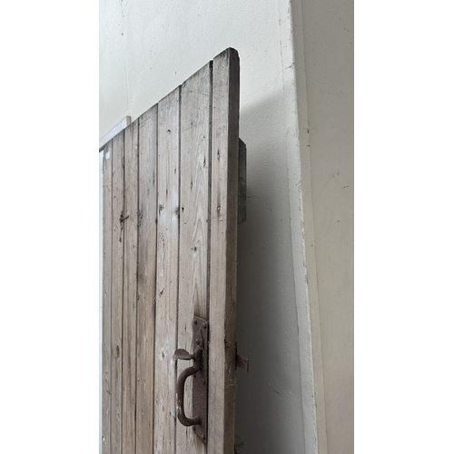 57 - A vintage wooden exterior door with metal hinges and latch - approx. 192cm high x 74cm wide