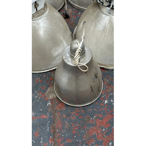 58 - Seven aluminium industrial pendant lights - largest approx. 61cm high x 47cm diameter