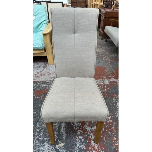 6 - A modern oak and glass top circular dining table and four grey fabric upholstered chairs - approx. 7... 