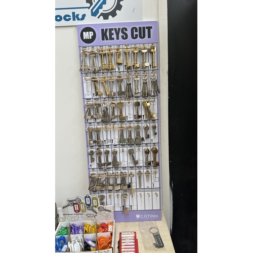 63 - An RST TM800 cylinder and mortice key cutting machine with a large quantity of keys, accessories and... 