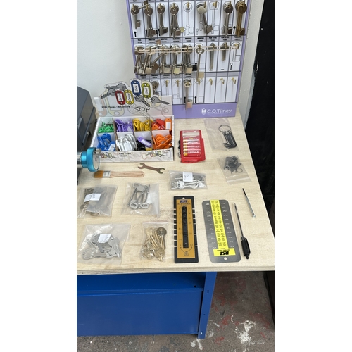 63 - An RST TM800 cylinder and mortice key cutting machine with a large quantity of keys, accessories and... 