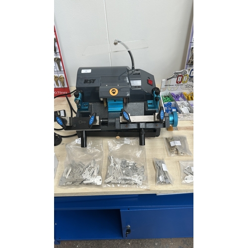 63 - An RST TM800 cylinder and mortice key cutting machine with a large quantity of keys, accessories and... 