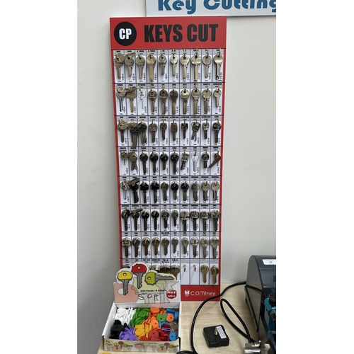 63 - An RST TM800 cylinder and mortice key cutting machine with a large quantity of keys, accessories and... 