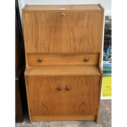 63B - A mid 20th century Remploy teak bureau - approx. 99cm high x 61cm wide x 35cm deep