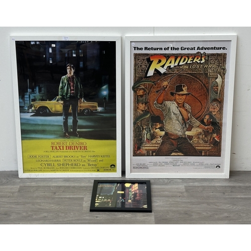 63C - Three framed reproduction prints, one Robert De Niro Taxi Driver, one Raiders of the Lost Ark and on... 
