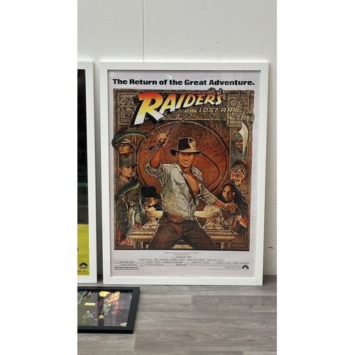 63C - Three framed reproduction prints, one Robert De Niro Taxi Driver, one Raiders of the Lost Ark and on... 