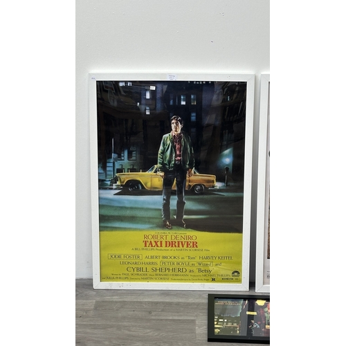 63C - Three framed reproduction prints, one Robert De Niro Taxi Driver, one Raiders of the Lost Ark and on... 