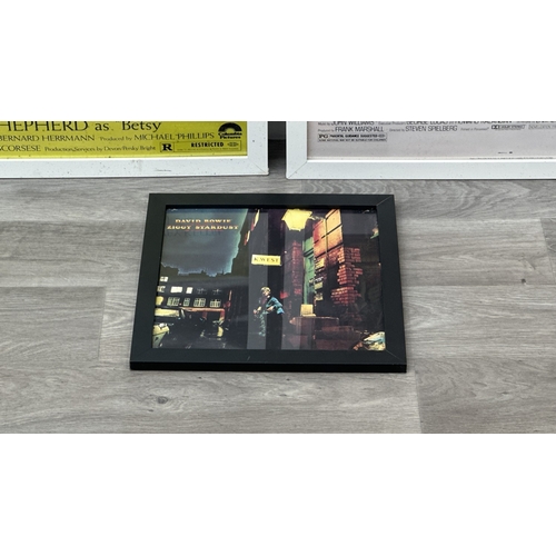 63C - Three framed reproduction prints, one Robert De Niro Taxi Driver, one Raiders of the Lost Ark and on... 