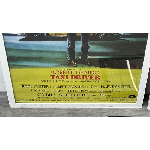 63C - Three framed reproduction prints, one Robert De Niro Taxi Driver, one Raiders of the Lost Ark and on... 