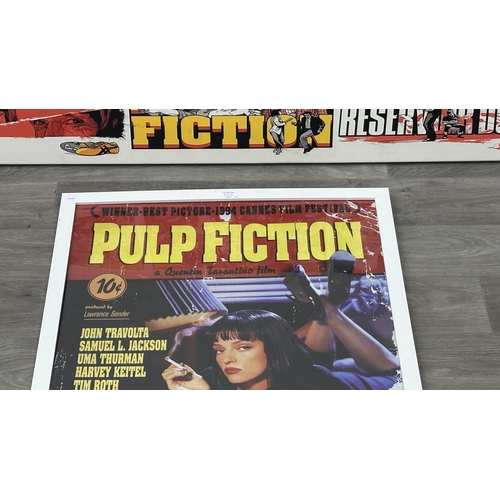 63D - Two reproduction prints, one framed Pulp Fiction poster - approx. 89cm high x 64cm wide and one canv... 
