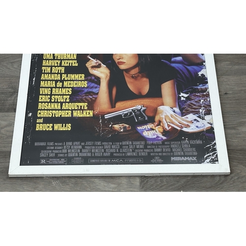 63D - Two reproduction prints, one framed Pulp Fiction poster - approx. 89cm high x 64cm wide and one canv... 