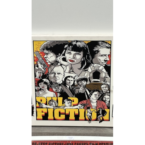 63D - Two reproduction prints, one framed Pulp Fiction poster - approx. 89cm high x 64cm wide and one canv... 