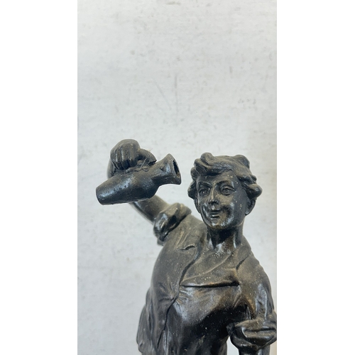 69 - Two French bronzed spelter figurines on ebonised plinths, one titled 'La Paysanne' and one titled 'L... 