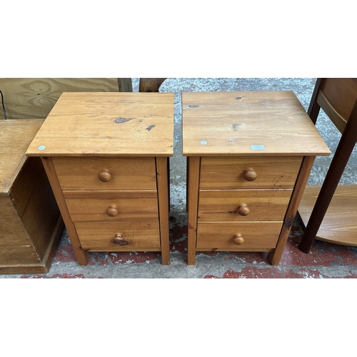 71 - A pair of pine bedside chests of drawers - approx. 61cm high x 43cm wide x 40cm deep
