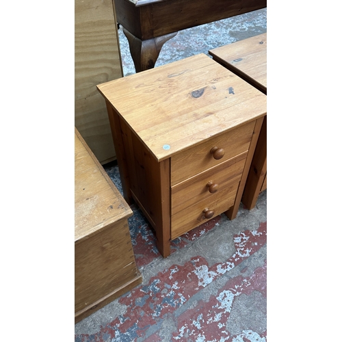 71 - A pair of pine bedside chests of drawers - approx. 61cm high x 43cm wide x 40cm deep