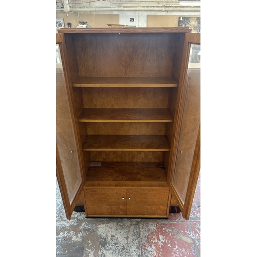 73 - An Art Deco style French walnut and rosewood effect cocktail/display cabinet - approx. 173cm high x ... 