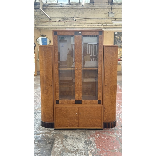 73 - An Art Deco style French walnut and rosewood effect cocktail/display cabinet - approx. 173cm high x ... 
