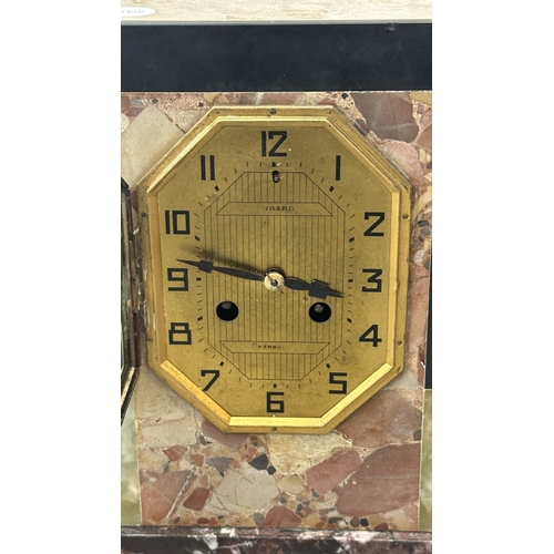 75 - An Art Deco French marble and onyx mantel clock featuring two spelter German Shepherd dog figurines ... 
