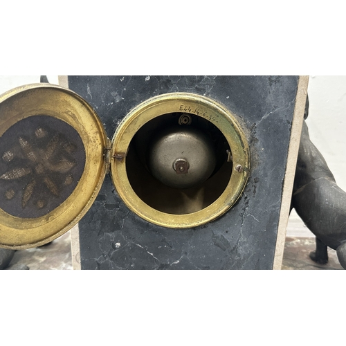 75 - An Art Deco French marble and onyx mantel clock featuring two spelter German Shepherd dog figurines ... 