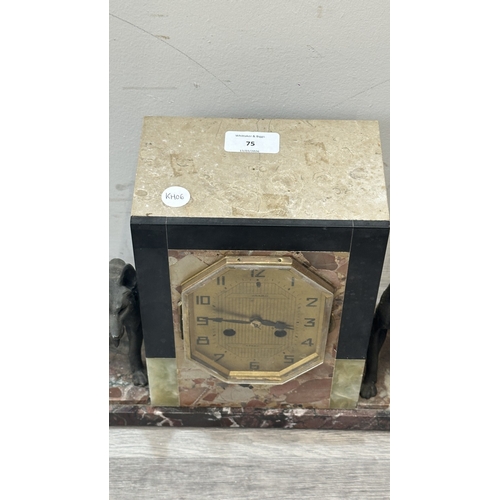 75 - An Art Deco French marble and onyx mantel clock featuring two spelter German Shepherd dog figurines ... 