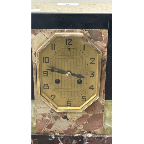 75 - An Art Deco French marble and onyx mantel clock featuring two spelter German Shepherd dog figurines ... 