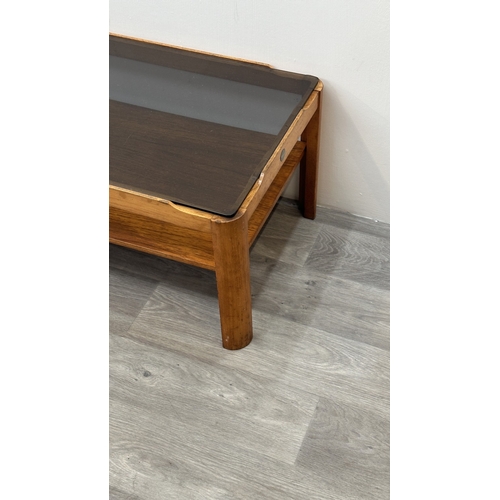 77 - A mid 20th century Myer teak and smoked glass coffee table - approx. 35cm high x 44cm wide x 87cm lo... 