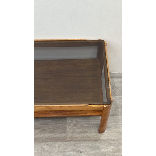 77 - A mid 20th century Myer teak and smoked glass coffee table - approx. 35cm high x 44cm wide x 87cm lo... 