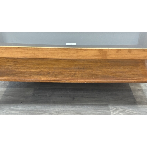 77 - A mid 20th century Myer teak and smoked glass coffee table - approx. 35cm high x 44cm wide x 87cm lo... 