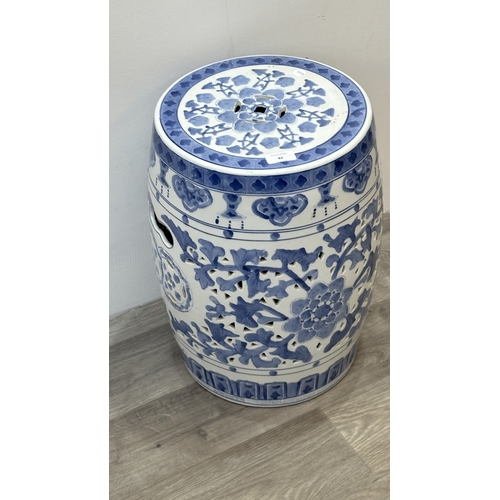 82 - A Chinese blue and white ceramic garden stool - approx. 45cm high x 30cm diameter